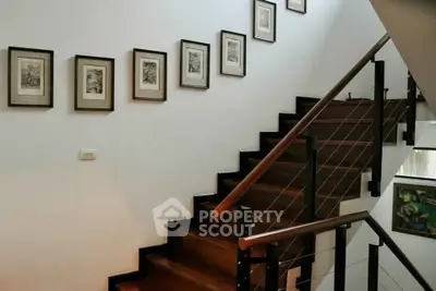 Elegant staircase with framed art in modern home interior