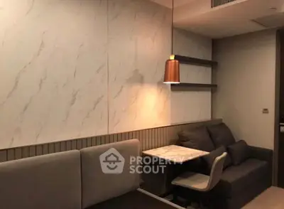 Modern living room with stylish marble wall and cozy seating area