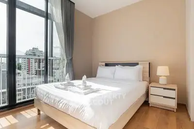 Bright and modern bedroom with city view and elegant decor