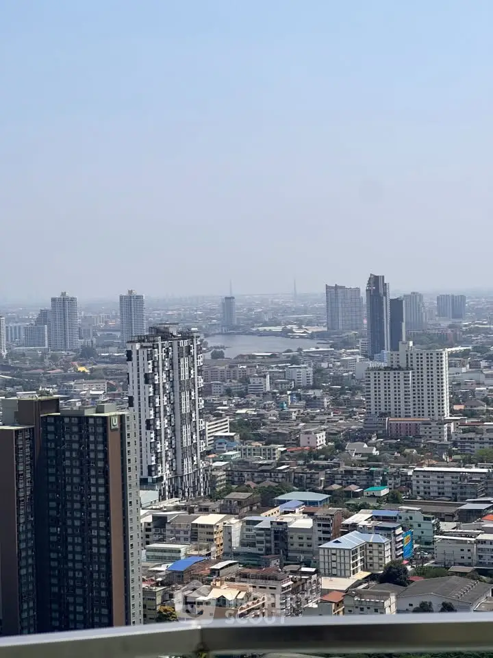 Stunning cityscape view from a high-rise balcony showcasing urban skyline and modern architecture.