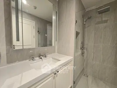 Modern bathroom with sleek design and glass shower enclosure