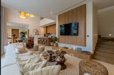 Luxurious open-plan living room with modern decor and stylish wooden accents