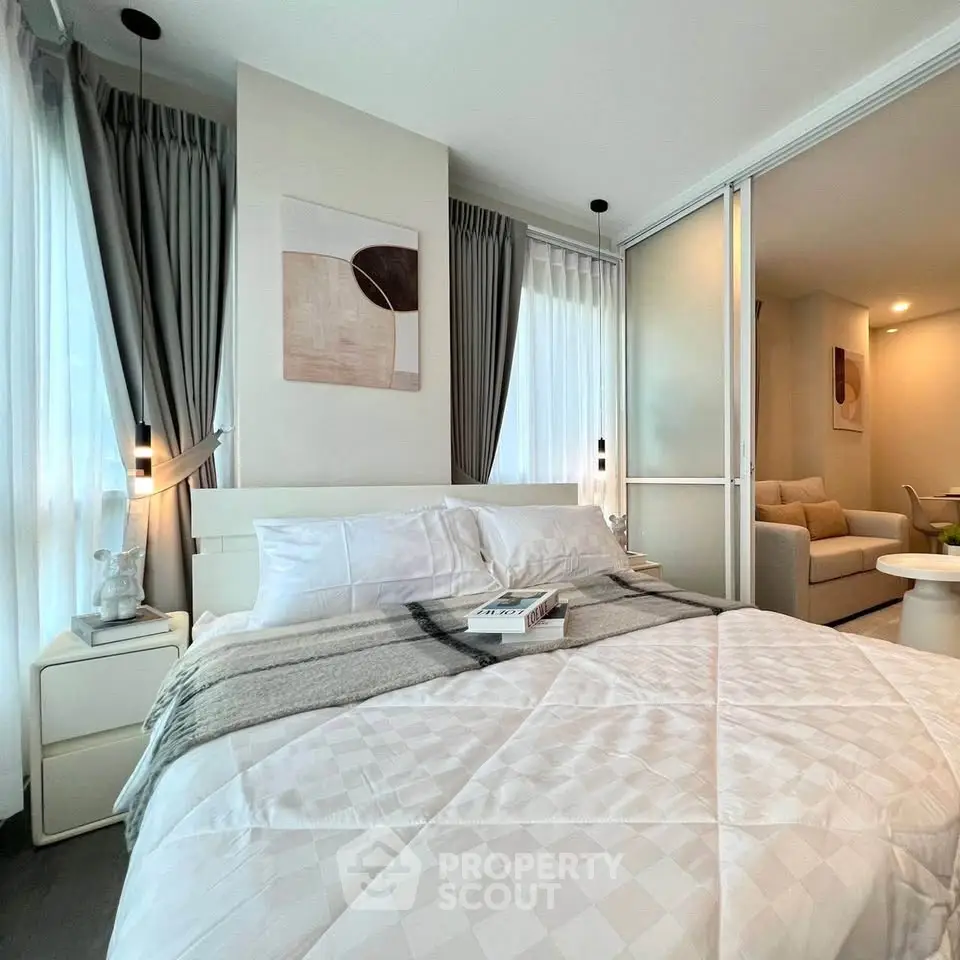 Modern bedroom with stylish decor and cozy ambiance in a contemporary apartment.