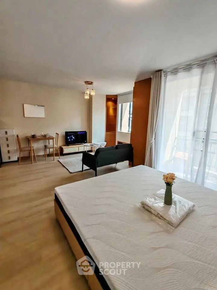 Spacious studio apartment with modern furnishings and natural light