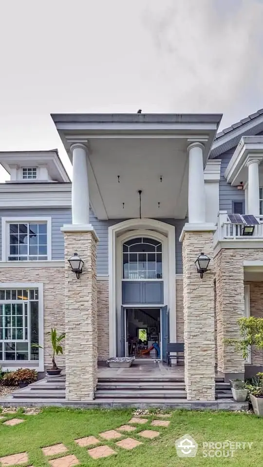 Stunning two-story home with grand entrance and elegant architectural details