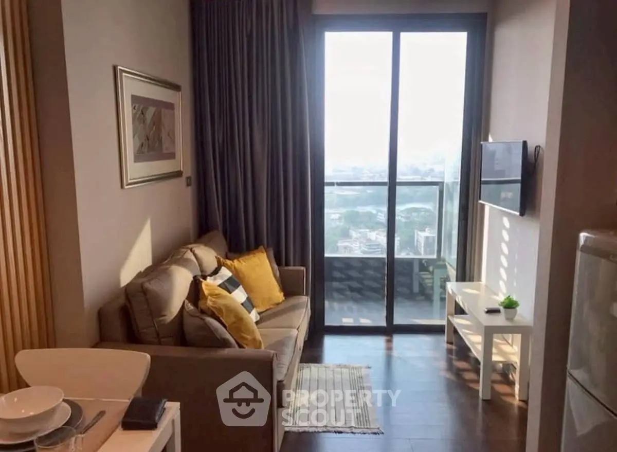 Cozy living room with balcony view in modern apartment