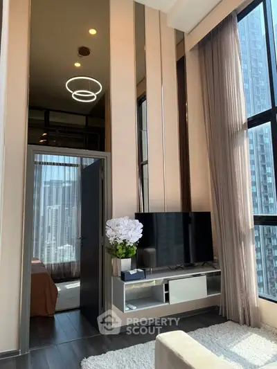 Luxurious high-rise apartment with floor-to-ceiling windows and modern interior design.