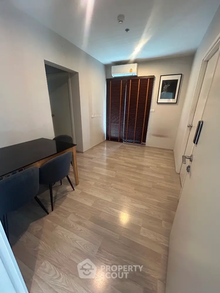 Modern interior with wooden flooring and stylish dining area in a cozy apartment.