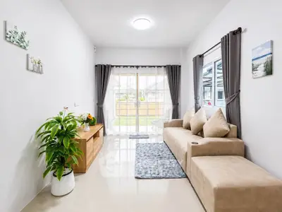 Bright and modern living room with large windows and stylish decor