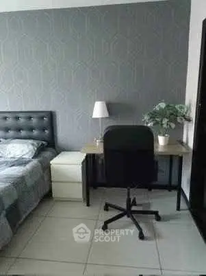 Modern bedroom with stylish decor and functional workspace