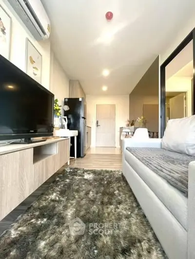 Modern living room with plush rug and sleek furniture, perfect for cozy gatherings.