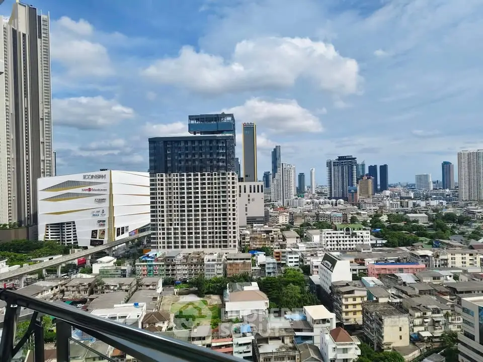 Stunning cityscape view from a high-rise balcony showcasing urban skyline and modern architecture.