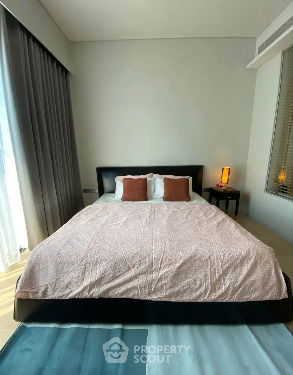 Modern bedroom with stylish decor and natural light