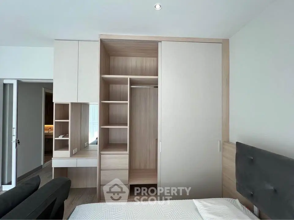 Modern bedroom with built-in wardrobe and sleek design