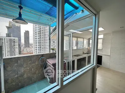 Spacious balcony with city view and modern interior design