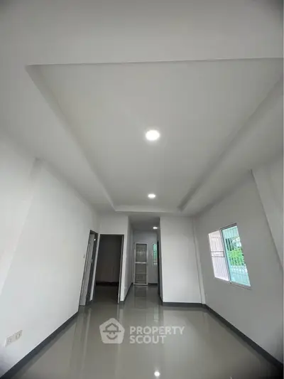 Spacious modern interior with sleek design and ample natural light, perfect for customization.