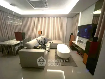 Luxurious living room with modern decor, plush seating, and ambient lighting for ultimate comfort and style.