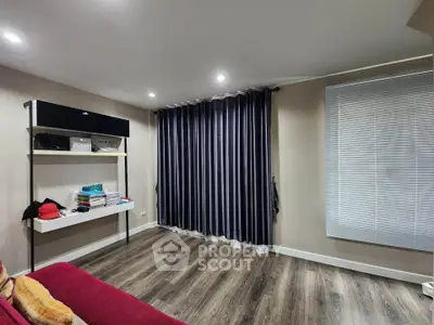 Modern living room with stylish flooring and elegant curtains