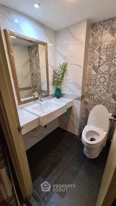 Stylish modern bathroom with elegant tiles and sleek fixtures