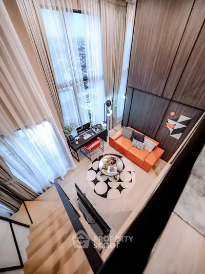 Luxurious loft-style living room with high ceilings and modern decor