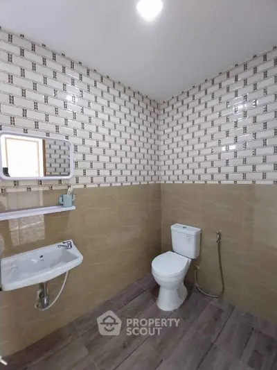 Modern bathroom with stylish tile design and sleek fixtures