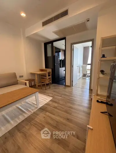 Modern living room with wooden flooring and stylish furniture