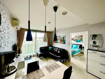 Modern living room with stylish decor and open view to bedroom