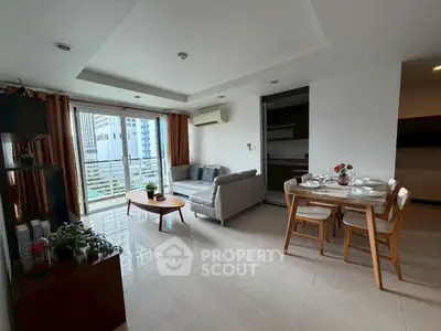 Spacious living room with modern decor and city view balcony