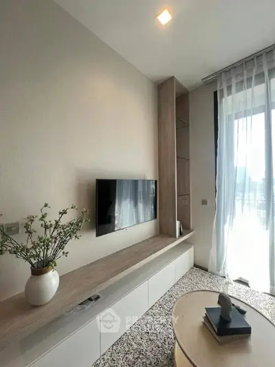 Modern living room with sleek TV setup and elegant decor