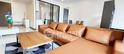 Spacious modern living room with stylish leather sofa and elegant decor