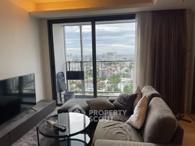 Modern living room with stunning city view from high-rise balcony