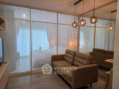 Modern living room with glass partition and cozy lighting in stylish apartment