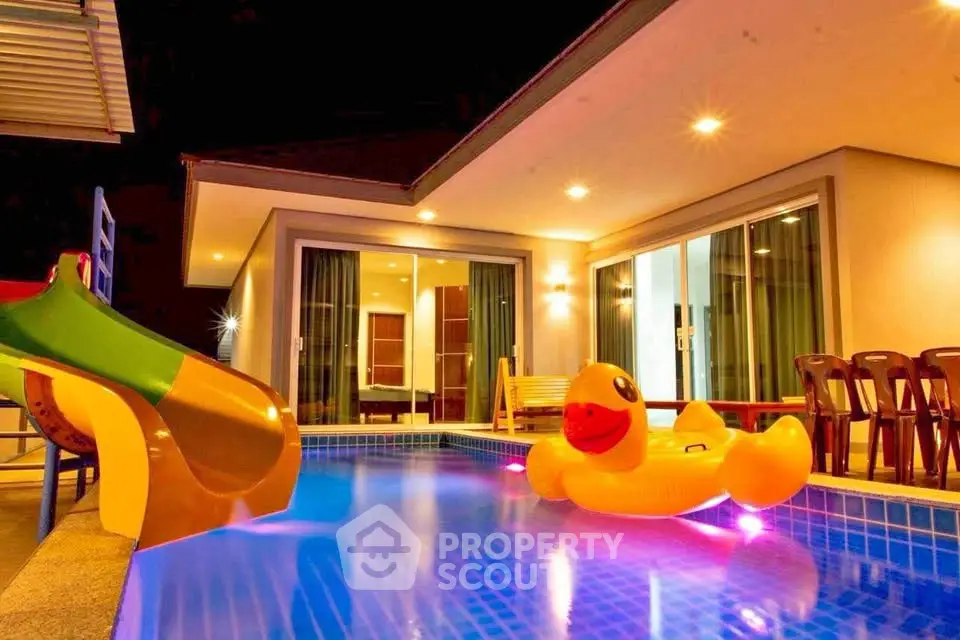 Luxurious villa with private pool and playful slide, perfect for family getaways.