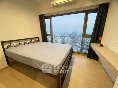 Spacious bedroom with stunning city view and modern furnishings