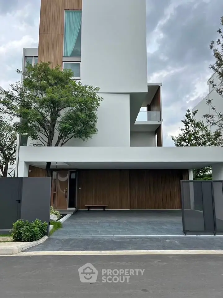 Modern architectural home with sleek design and spacious driveway