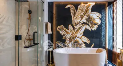 Luxurious bathroom with elegant bathtub and artistic floral wall design