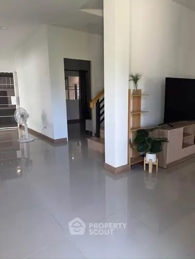 Spacious modern living room with sleek tile flooring and stylish decor