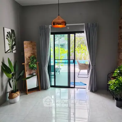 Bright living room with pool view and modern decor