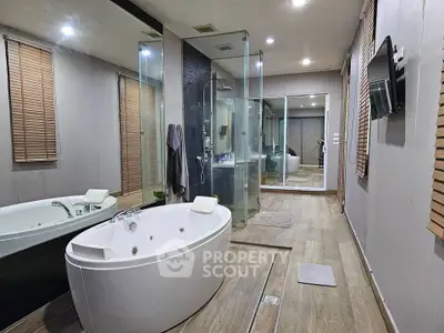 Luxurious bathroom with modern jacuzzi and glass shower enclosure