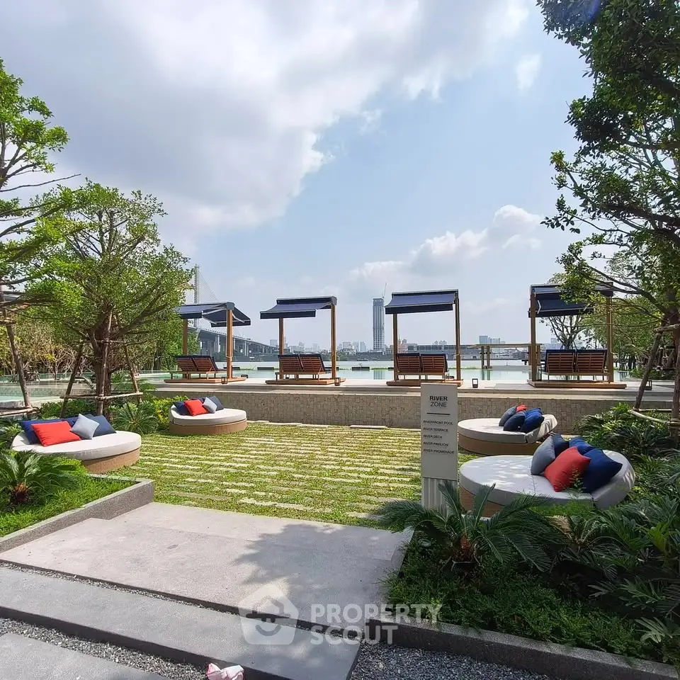 Luxurious outdoor pool area with stylish seating and stunning city view, perfect for relaxation and leisure.