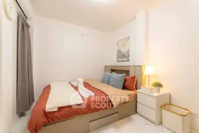 Cozy bedroom with modern decor and soft lighting, perfect for relaxation.
