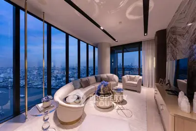 Luxurious high-rise living room with panoramic city views and elegant modern decor.