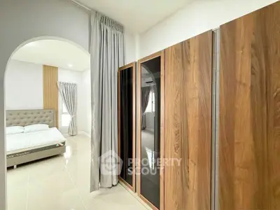 Modern bedroom with elegant wooden wardrobe and stylish decor