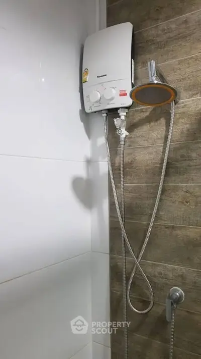 Modern bathroom shower with water heater and sleek design