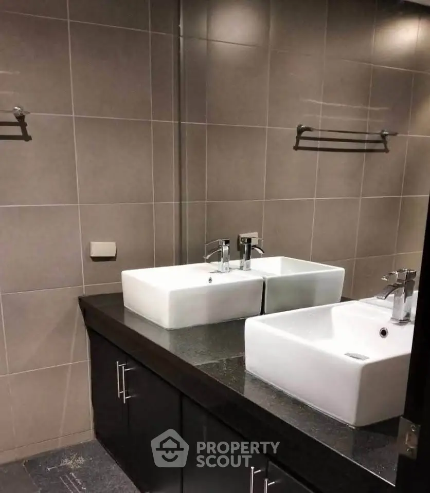 Modern bathroom with dual sinks and sleek design