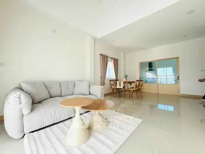 Spacious modern living room with elegant dining area and stylish furniture