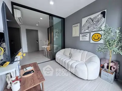 Modern living room with stylish decor and cozy sofa in a contemporary apartment.