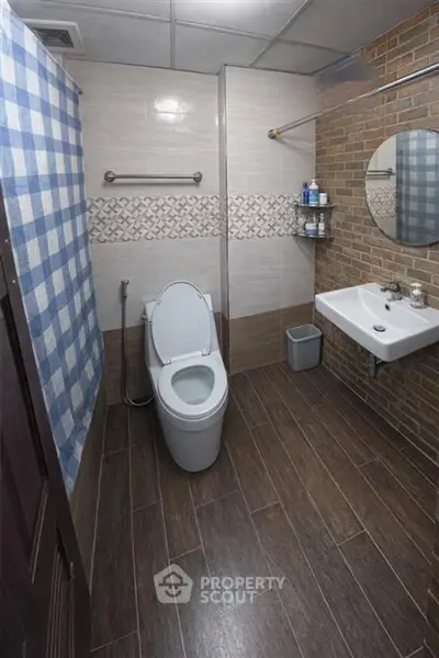 Modern bathroom with stylish tile design and sleek fixtures in a contemporary home.