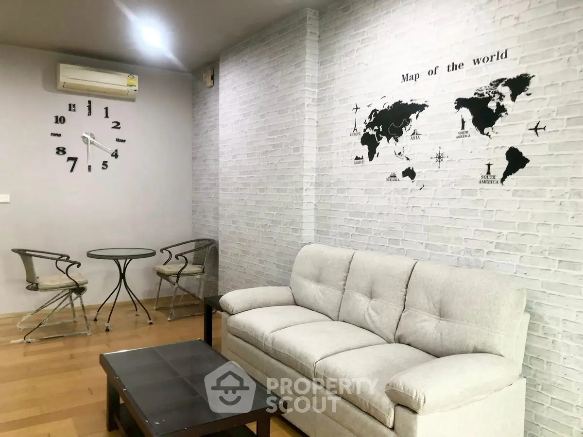 Stylish living room with world map wall art and modern furniture