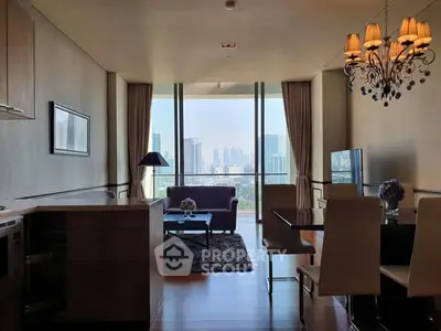 Luxurious living room with stunning city view, elegant chandelier, and modern furnishings in high-rise apartment.